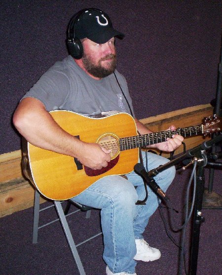 Picture of Ted recording with guitar